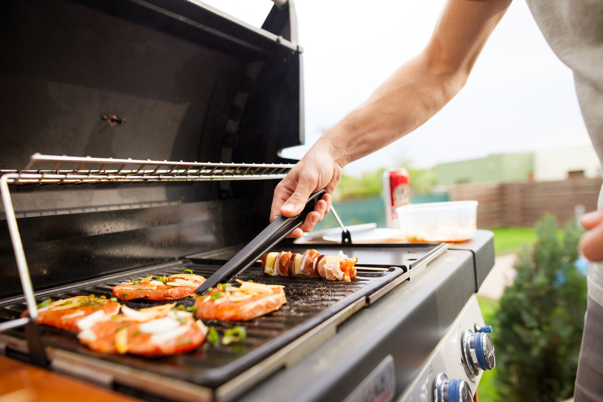 man-grilling-meat-vegetables-grill-web